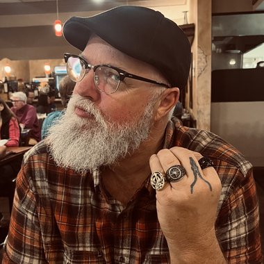 John N. - Freelance Graphic Designer