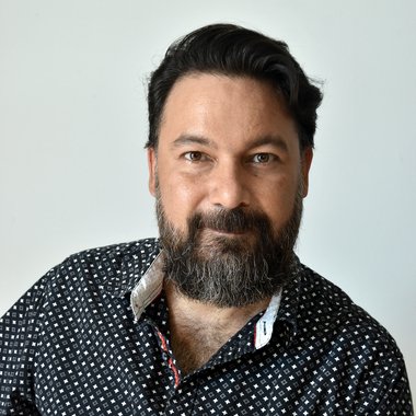 Juan A. - Freelance Graphic Designer