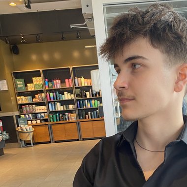 Cameron I. - Freelance Graphic Designer